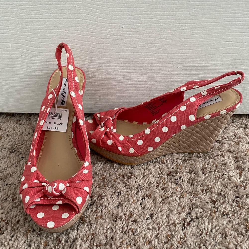 Women’s coral and white polka dot wedges